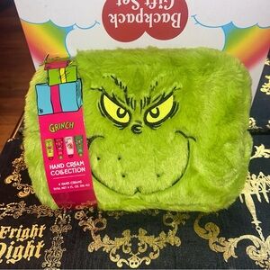 The Grinch four piece Hand Cream Collection and fuzzy makeup bag gift set.